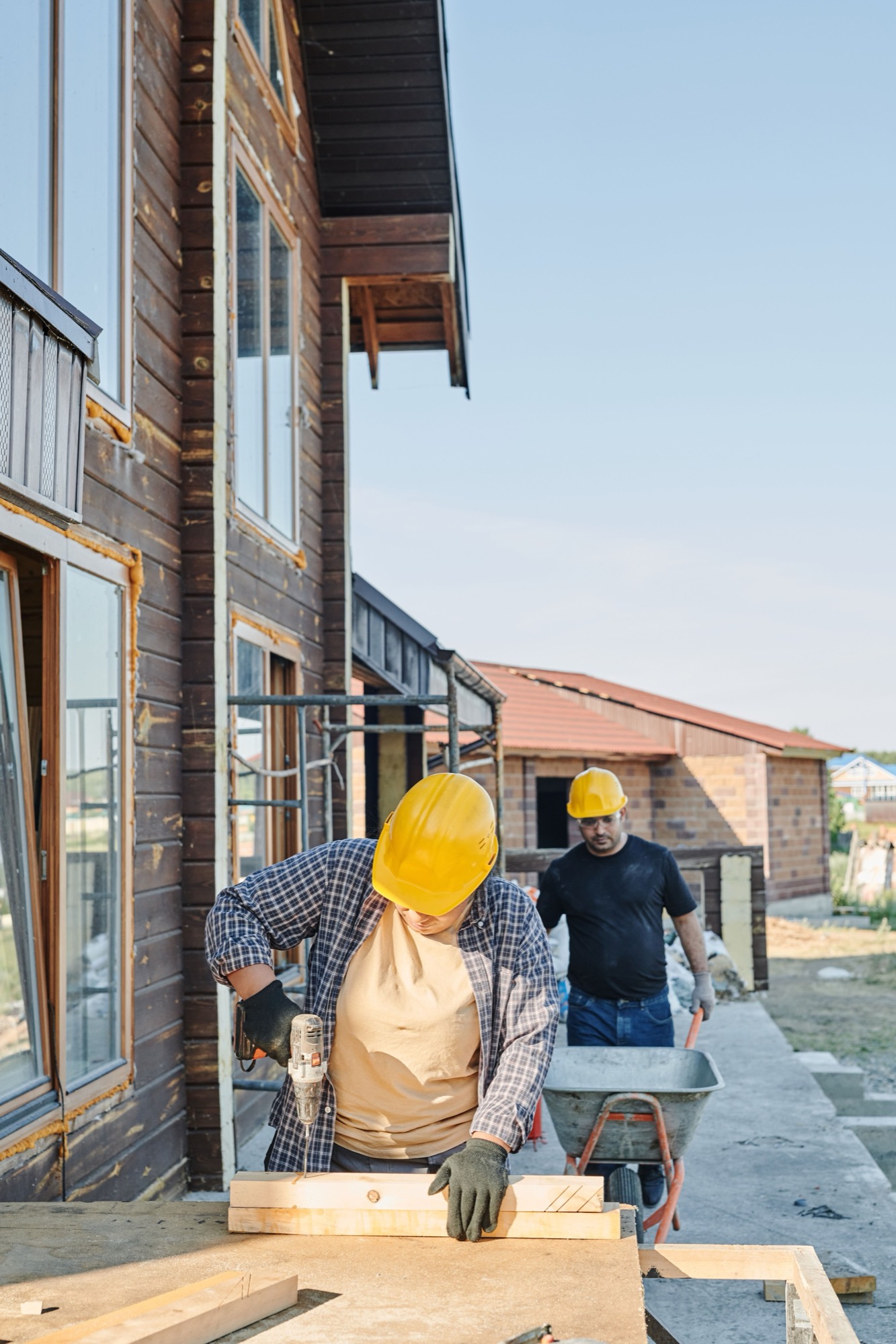 Builders working at a residential construction site